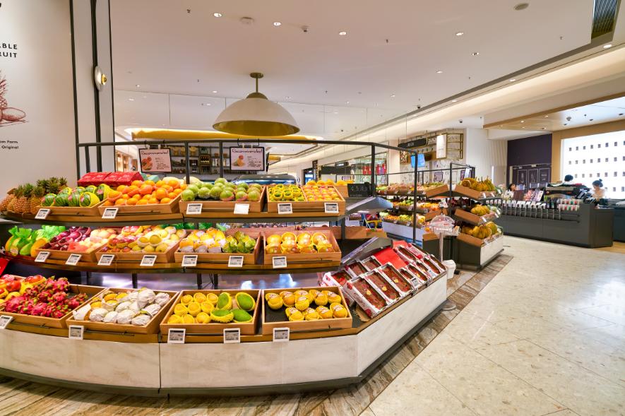 A grocery displays fresh fruits from Thailand